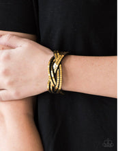 Cargar imagen en el visor de la galería, Paparazzi 💜 &quot;Looking for Trouble&quot; -- Gold Wrap Bracelet
